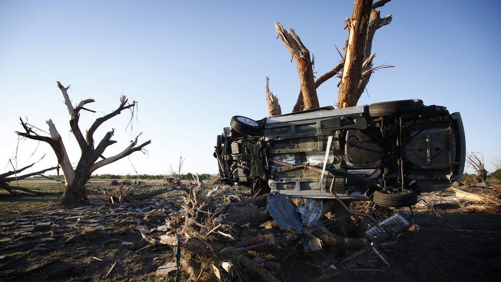 A car wedged next to a tree after OKlahoma tornado - 25 May 2013