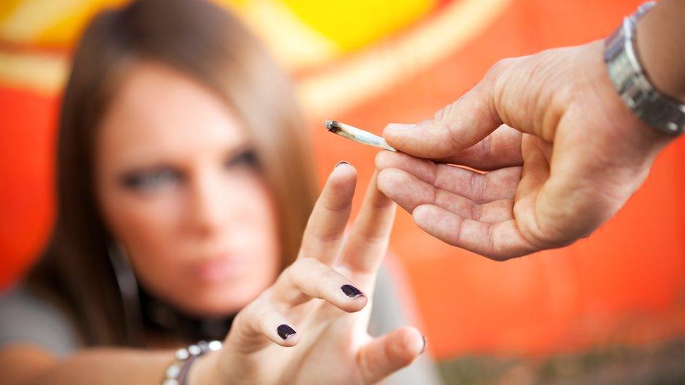 A woman smoking cannabis