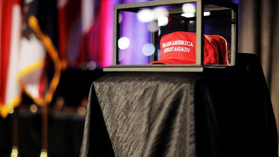 A 'Make America Great Again' hat sits in a glass case during Republican presidential nominee Donald Trump's election night party at the New York Hilton Midtown on November 8, 2016 in New York City. Americans today will choose between Republican presidential nominee Donald Trump and Democratic presidential nominee Hillary Clinton as they go to the polls to vote for the next president of the United States. (Photo by Chip Somodevilla/Getty Images)