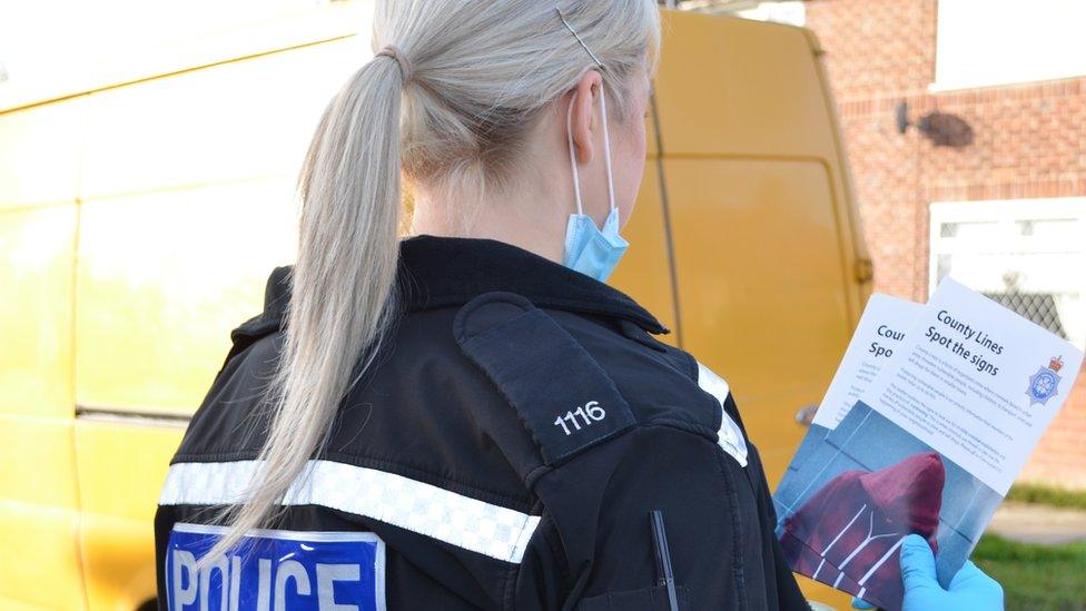 Officer handing out information leaflets