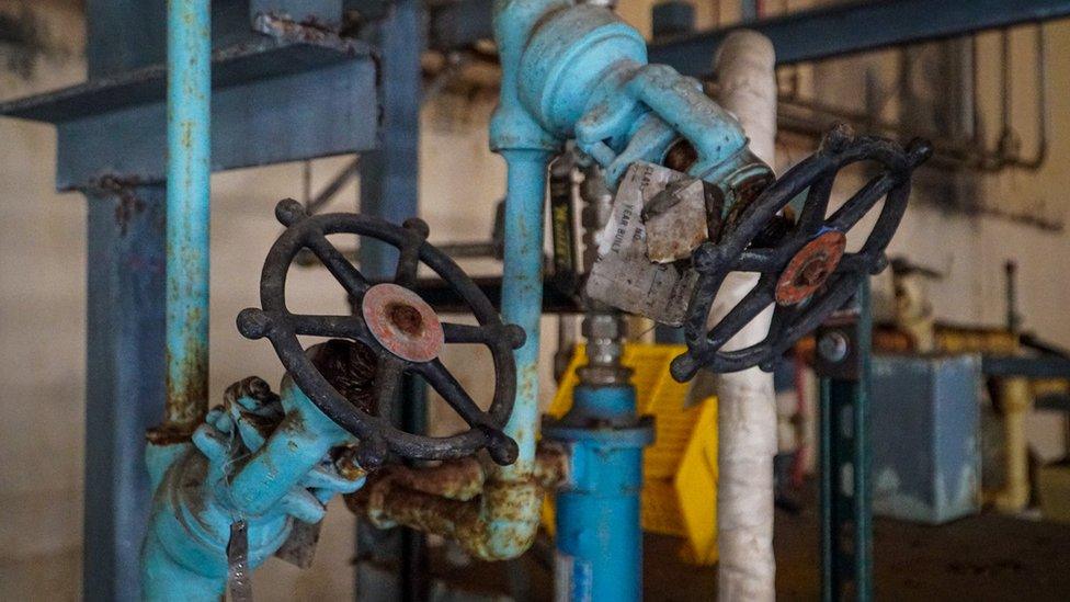 Rusty looking pipes inside the Bataan plant