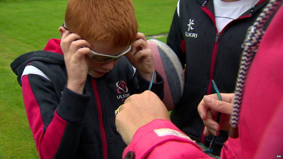 Ryan Totten putting on his sports goggles