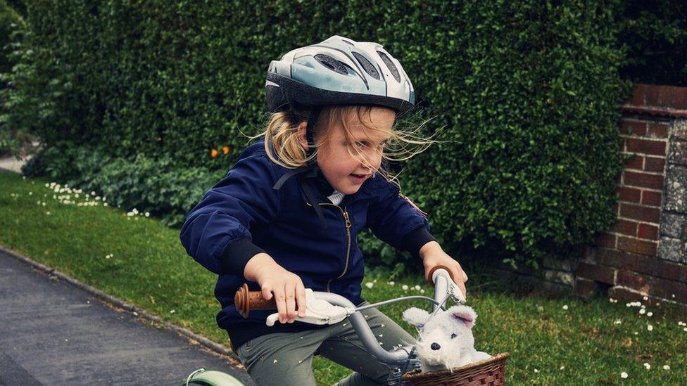 A girl on a bike