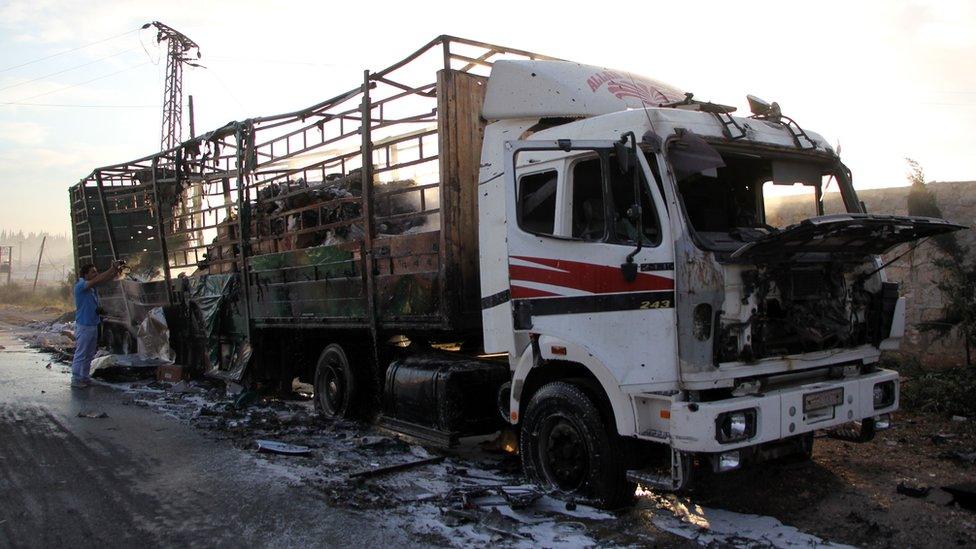 A damaged truck carrying aid is seen on the side of the road in the town of Orum al-Kubra on the western outskirts of the northern Syrian city of Aleppo, 20 September 2016