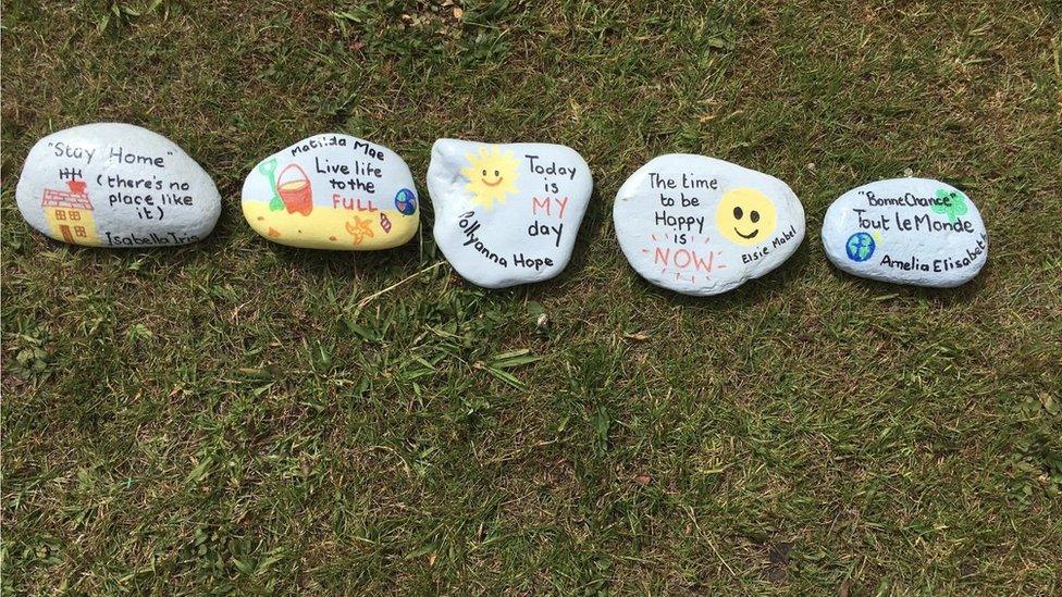 Pebbles painted with positive messages