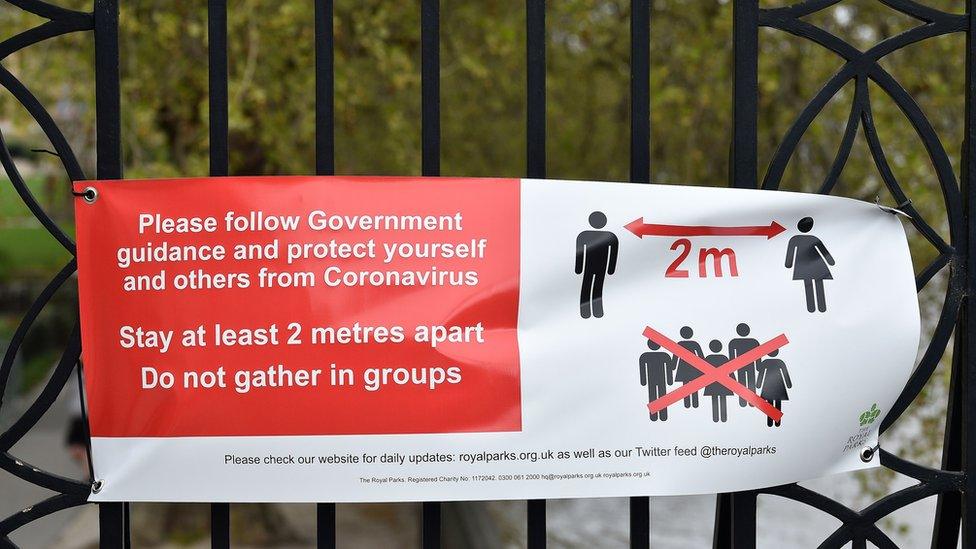 Sign in London park outlining government social distancing rules