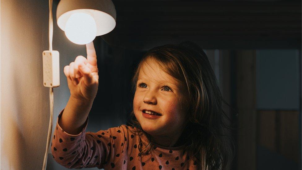 Girl and light bulb