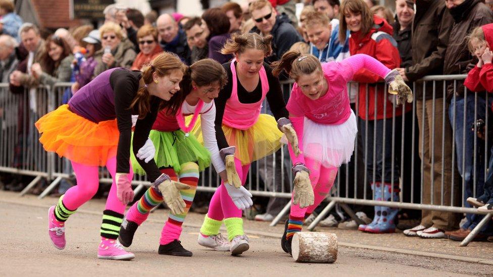 Girls rolling cheese in Stilton