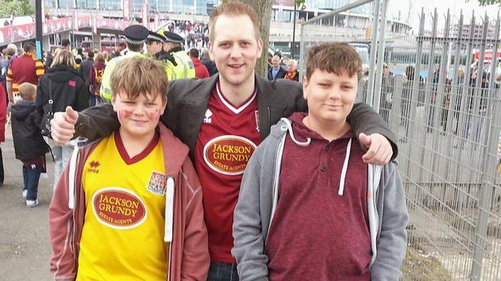 Harry and twin brother Niall with older brother, Miles, at Wembley in 2013