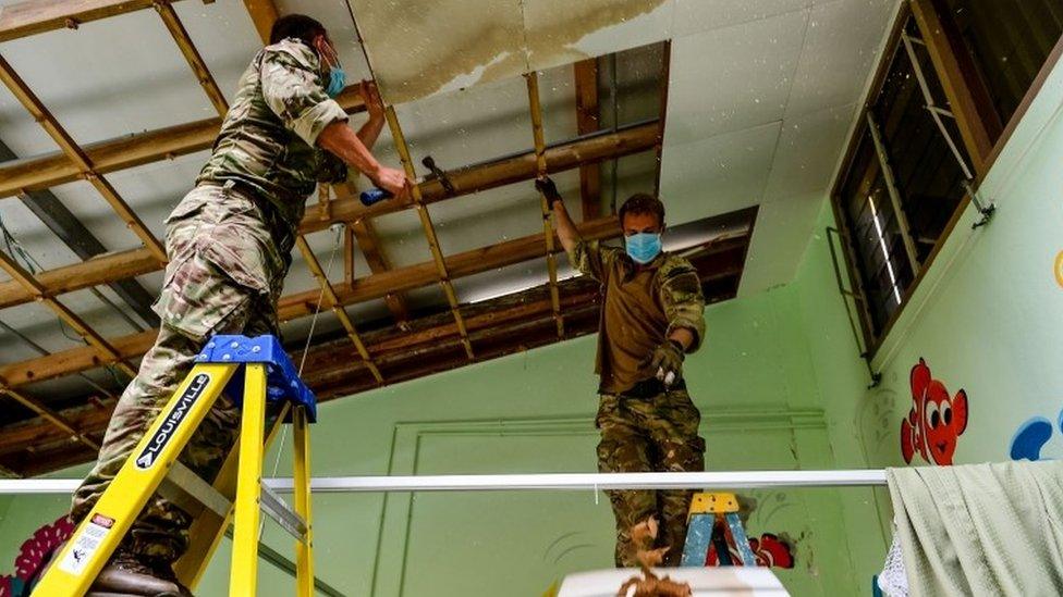 Royal Marines clearing up the damage at Princess Alexandra Hospital on the island of Anguilla