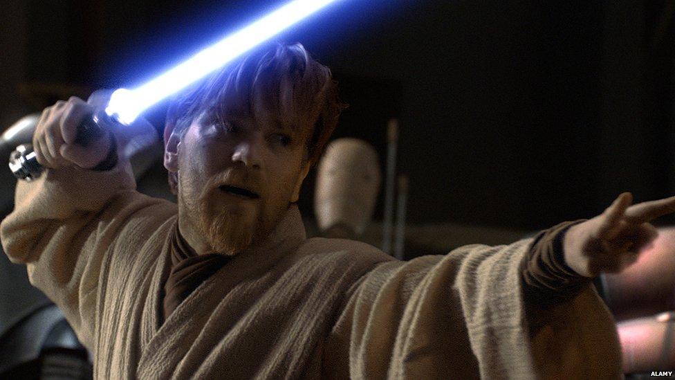 Obi Wan Kenobi with a lightsaber