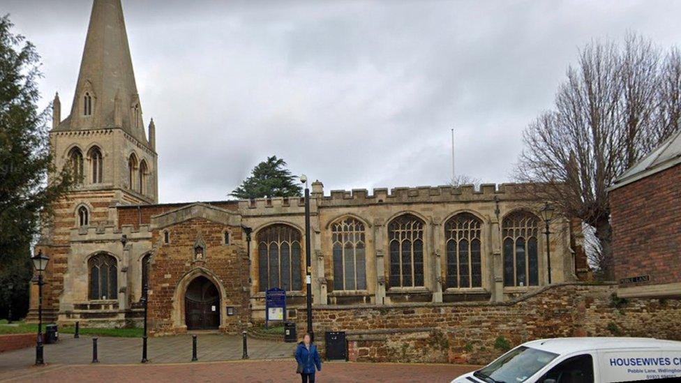 Stone church building with spire