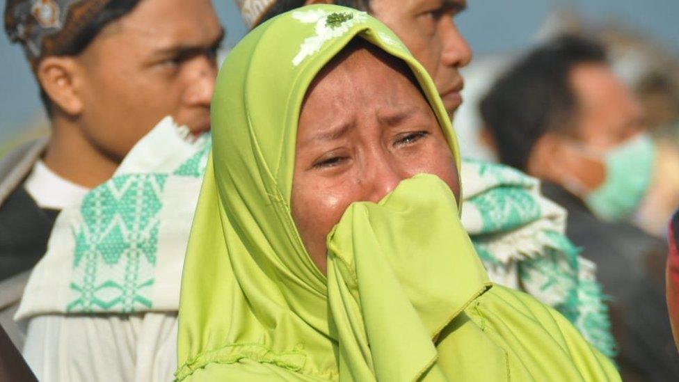 A woman cries following an earthquake and a tsunami in Palu, Sulawesi island, 29 September 2018