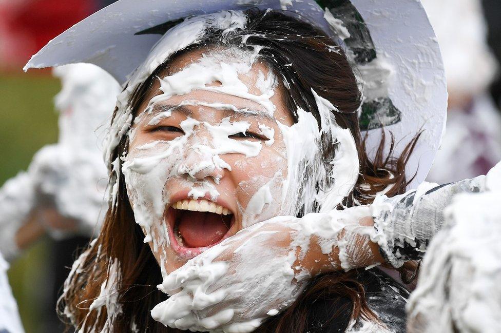 Girl smiling covered in shaving foam