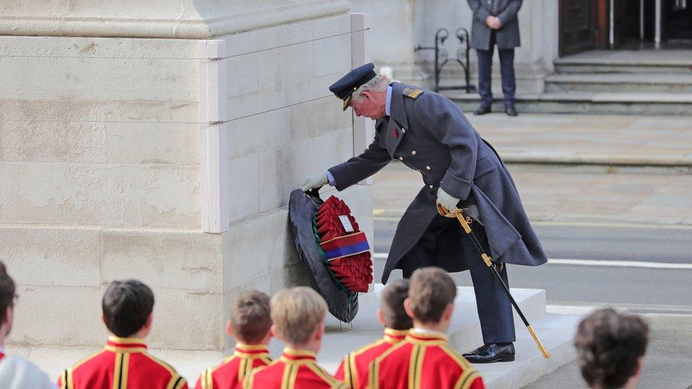 Prince Charles laying a wreath