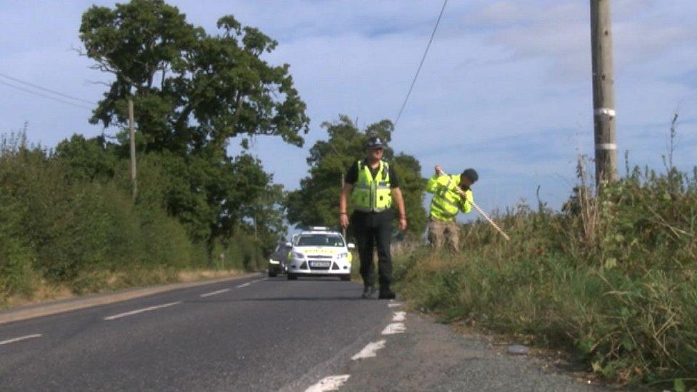 Police searching near a road