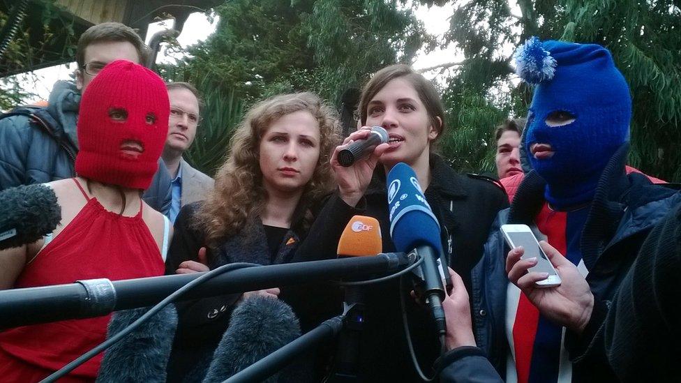 Nadezhda Tolokonnikova (R) and Maria Alyokhina speak to the press with fellow Russian punk group Pussy Riot members on February 20, 2014 in Sochi