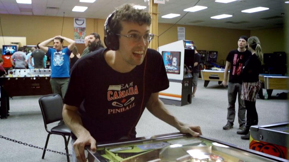 Robert Gagno playing pinball