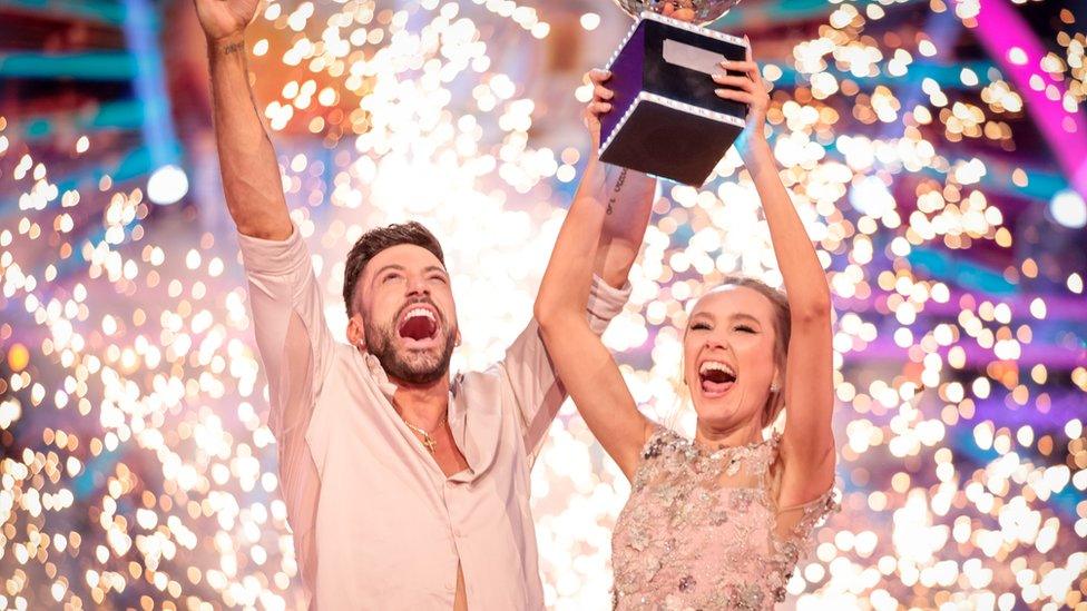 rose ayling ellis and giovanni pierce celebrating following their strictly final win with rose holding the strictly glitterball trophy above her head