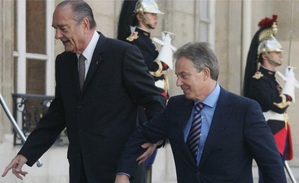 French President Jacques Chirac (L) greets British Prime Minister Tony Blair as he arrives in the courtyard of the Elysee Palace on May 11, 2007