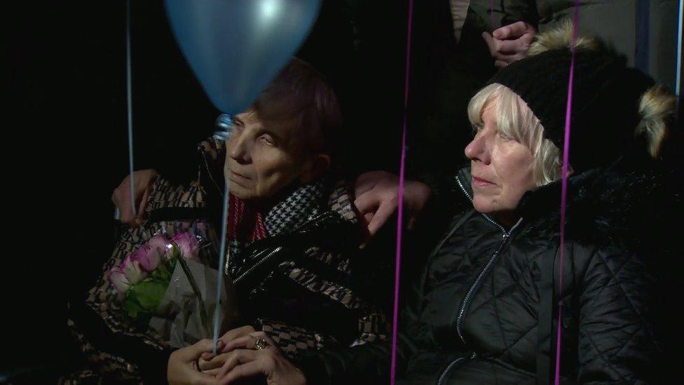 Women seated at the vigil