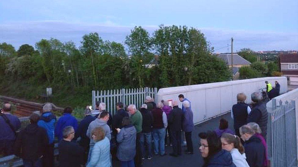 Crowd on a bridge near Bristol Parkway station