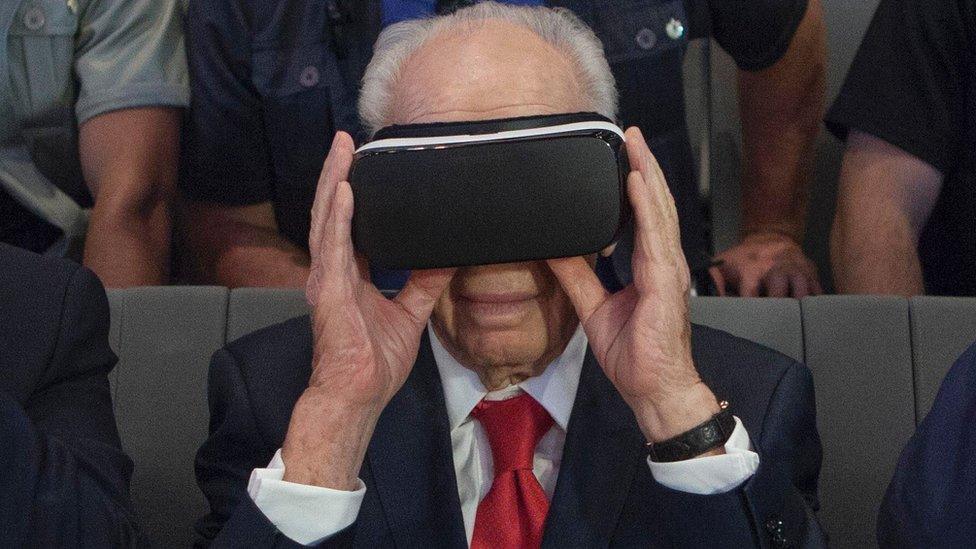 Israel's former president Shimon Peres uses virtual reality goggles during a ceremony at the Peres Center for Peace in the coastal city of Jaffa, 21 July 2016