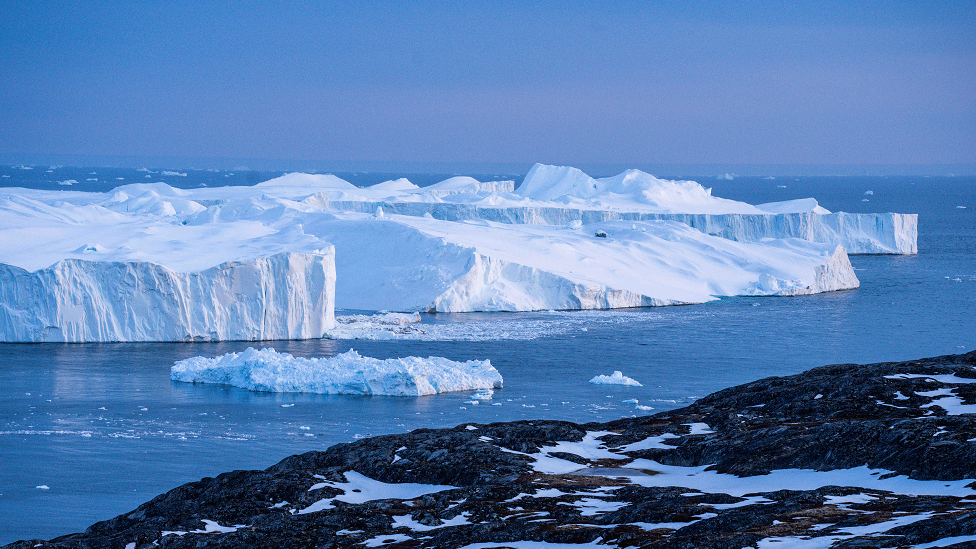 Icebergs, calved from the Sermeq Kujalleq glacier, float in the Ilulissat Icefjord.