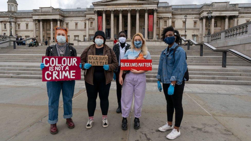 protestors-with-signs-in-London.