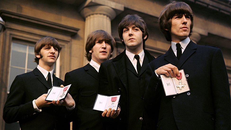 The Beatles receiving MBEs