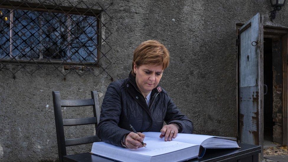 Nicola Sturgeon signs visitor book