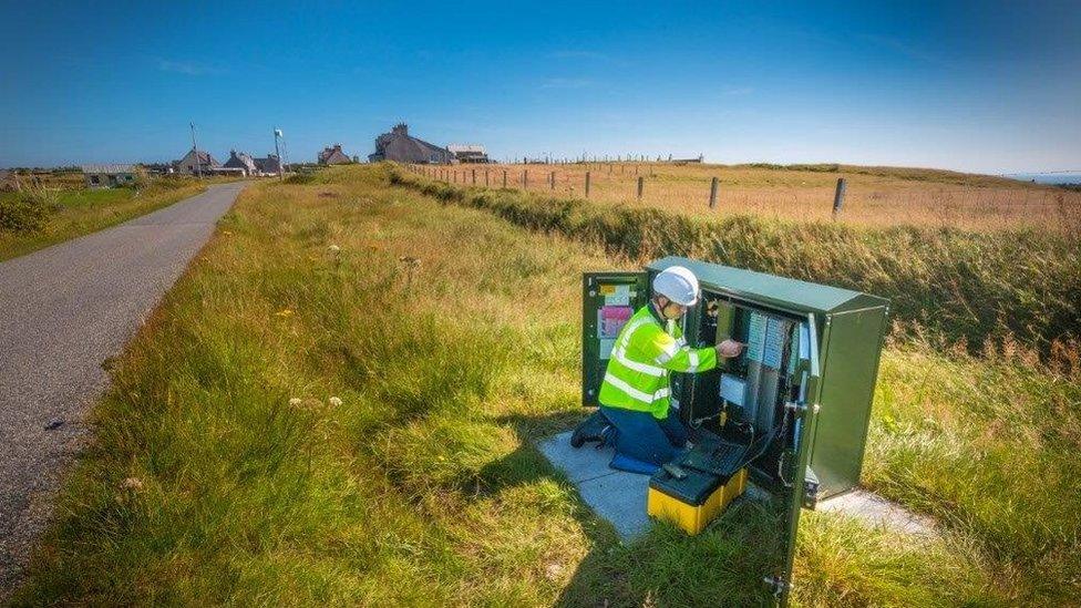 Engineer working on a fibre cabinet