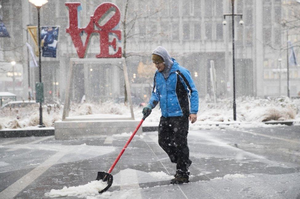 Snow falls outside Philadelphia's City Hall