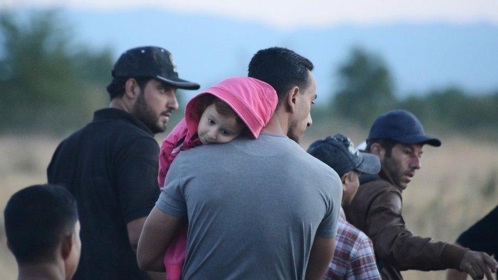 Syrian refugees wait near the border train station of Idomeni, northern Greece, to be allowed by the Macedonian police to cross the border from Greece to Macedonia on Tuesday, 18 August 2015