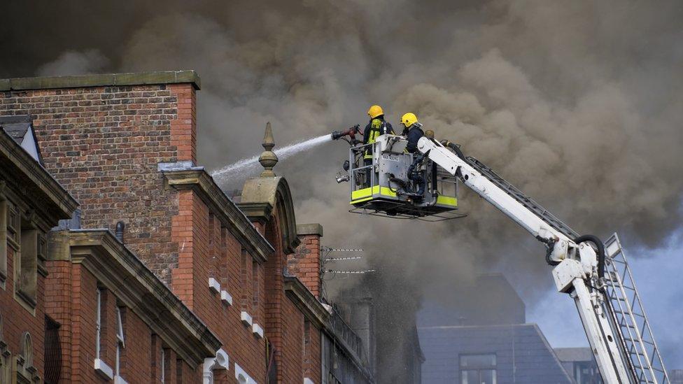 Firefighters tackle a building fire