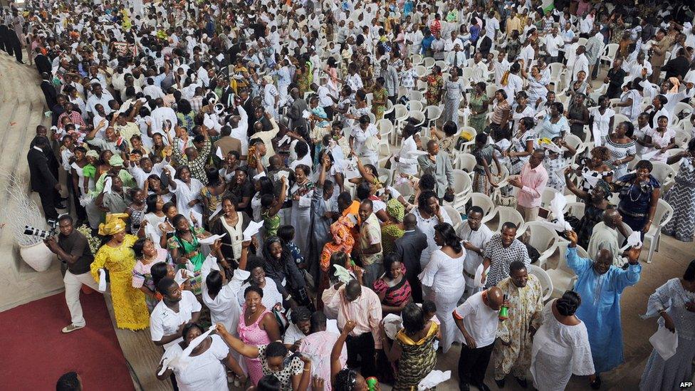 Worshippers dance in thanks to God for the election of Ghana's new President John Atta-Mills (unseen) during thanks giving worship service at the Pure Fire Miracle Church at Achimota, in Accra on January 4, 2009.