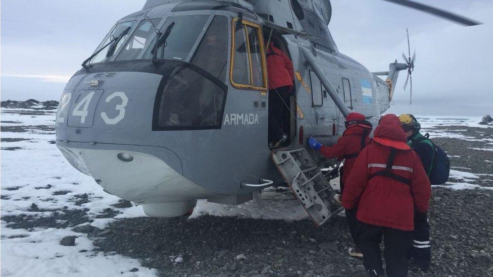 A photo published by the Argentine Foreign office shows Argentine Navy personnel helping US scientists load their equipment