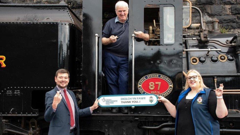 Volunteers and staff on a locomotive