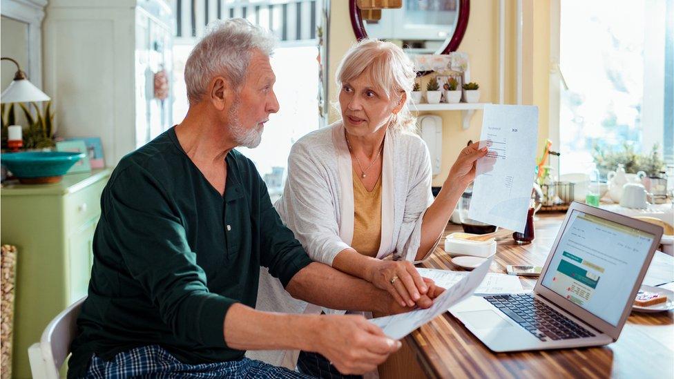 Couple discuss bills - stock shot