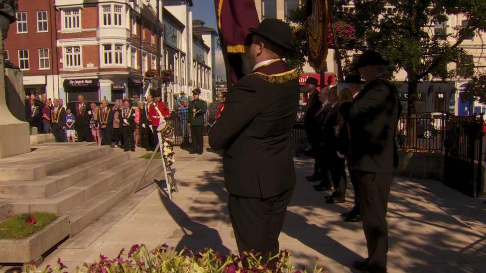 Wreath laying ceremony at war memorial in Derry