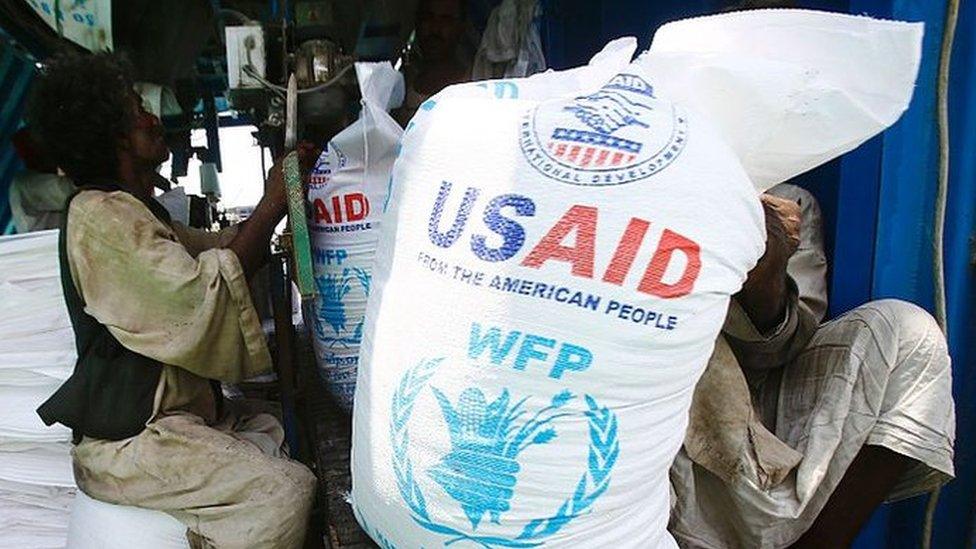 Sudanese dockers unload a US aid shipment organised by the US Agency for International Development and the World Food Programme at Port Sudan