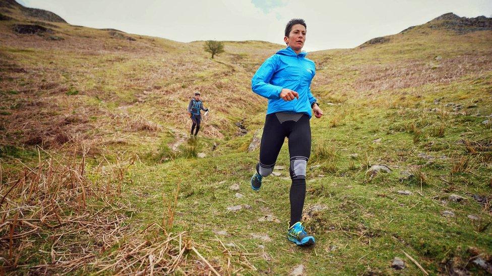 Sabrina Verjee descending to Easdale from Helm Crag