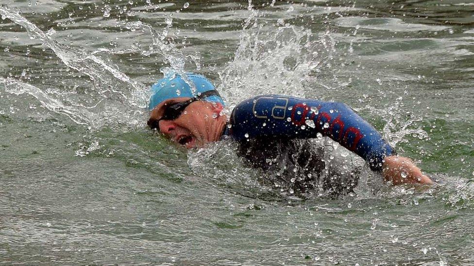 Paul Pester swimming during a triathlon