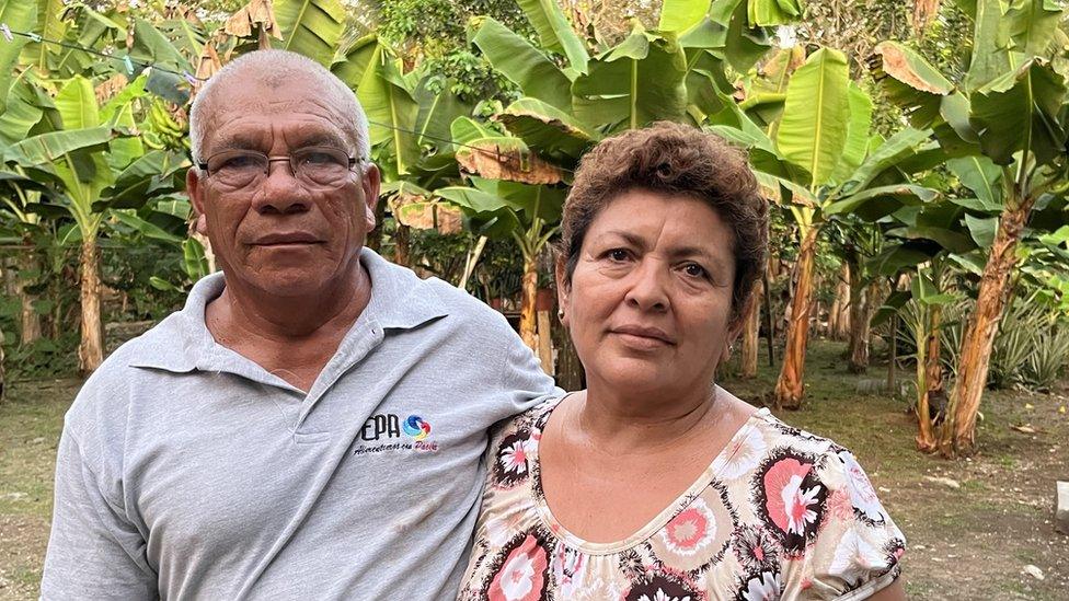 Isabel Coba Mojica stands next to his wife Delvia