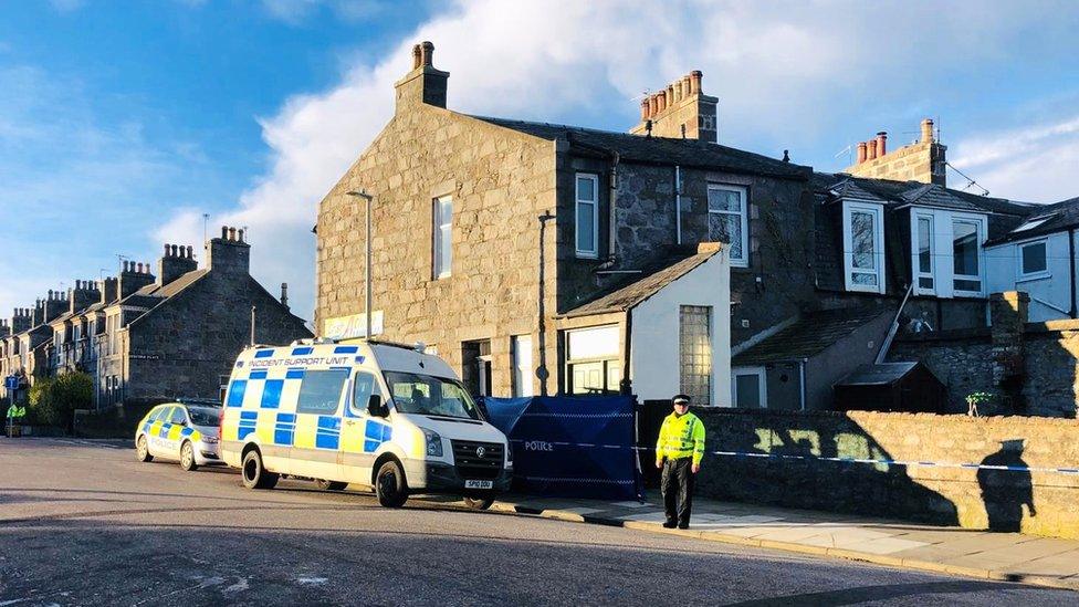 Police officers standing outside the property on Sunnyside Road, Aberdeen