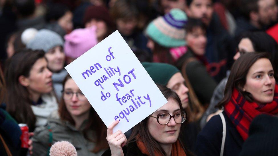 People, mainly women, take part in a rally during the International Women's Day in central Brussels, Belgium