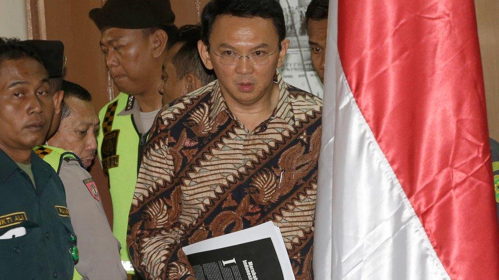 Jakarta Governor Ahok enters the courtroom before his blasphemy trial