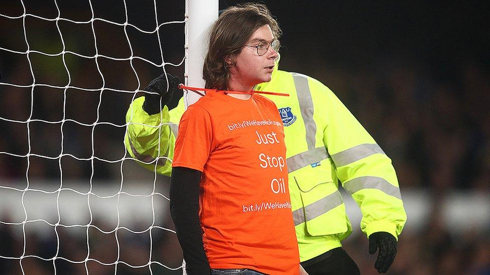 Protester tied to goalpost