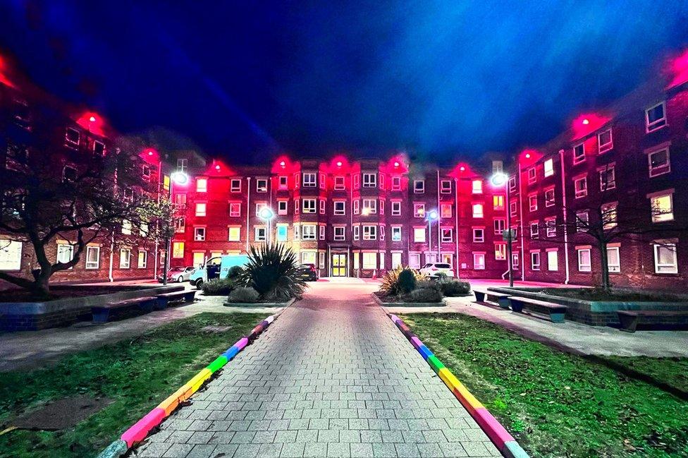 City Hospital in the dark lit up with red lights