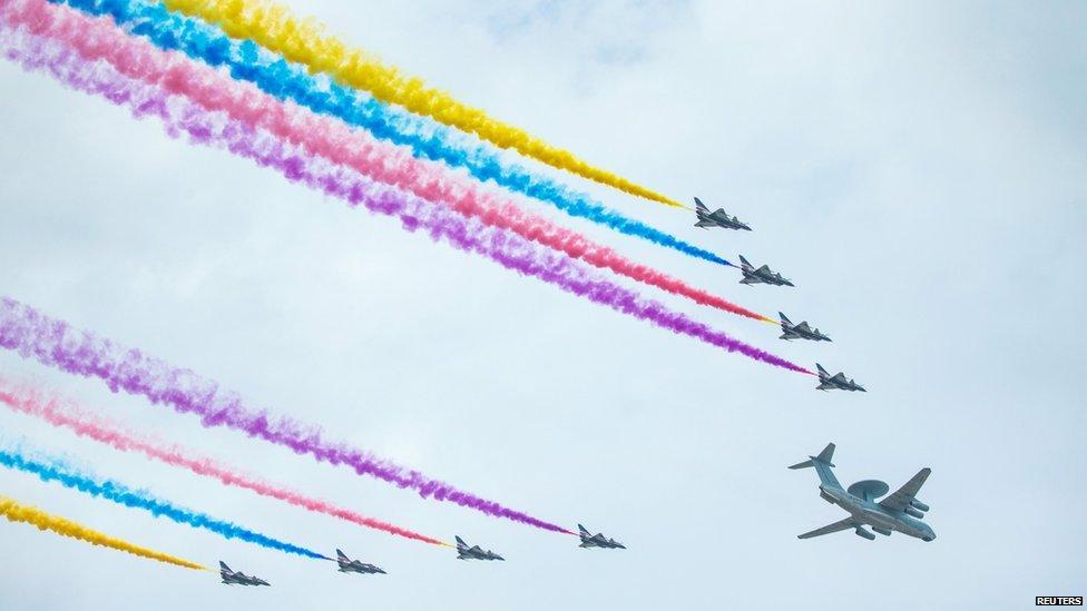 Aircraft perform during a rehearsal for a military parade in Beijing August 23, 2015